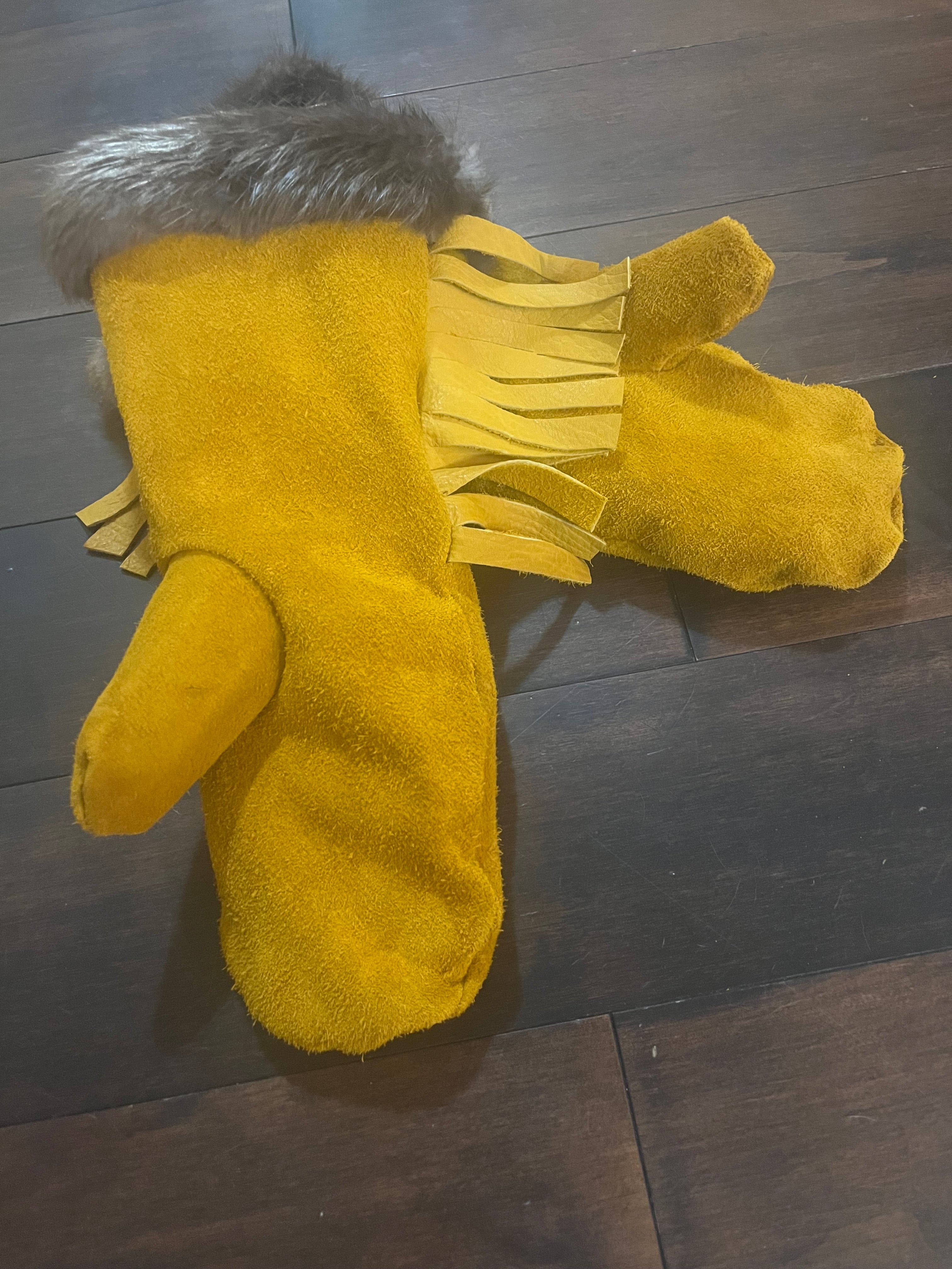 Leather mittens, fringe, fur trim and sheared sheep liner