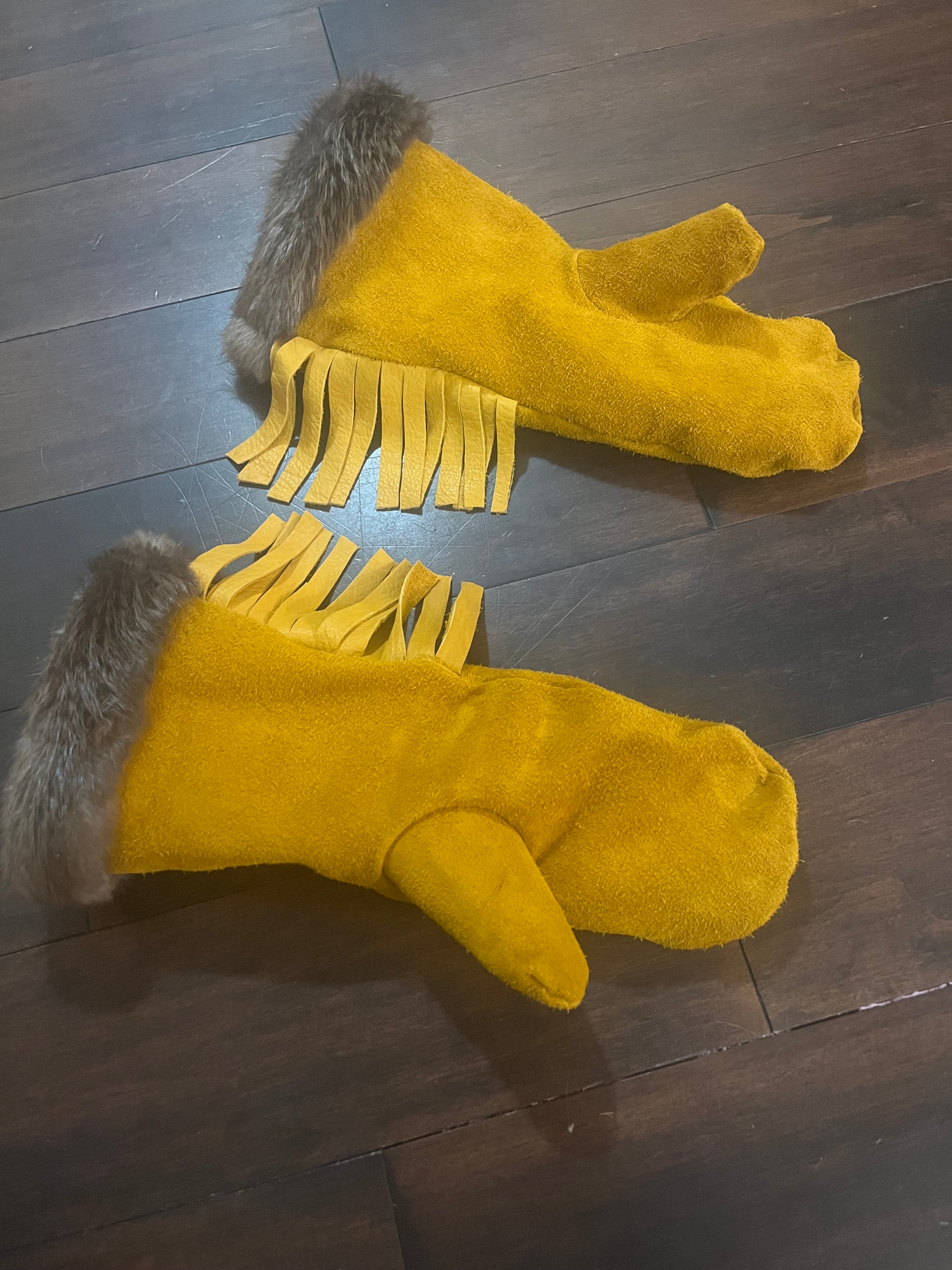 Leather mittens, fringe, fur trim and sheared sheep liner